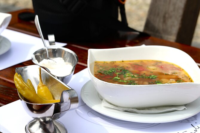 Bite your way through Timisoara - Timisoara's Street Food Tour - Crossing Victory Square and reading Timisoara’s 20th-century buildings